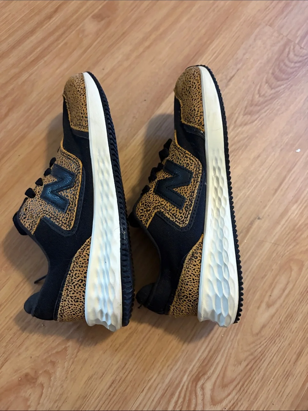 New Balance women’s Black and Tan Leopard-Print Sneakers